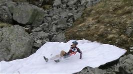 Tao tries out the first serious patch of snow we have found on our travels, 8.2 miles into the ride